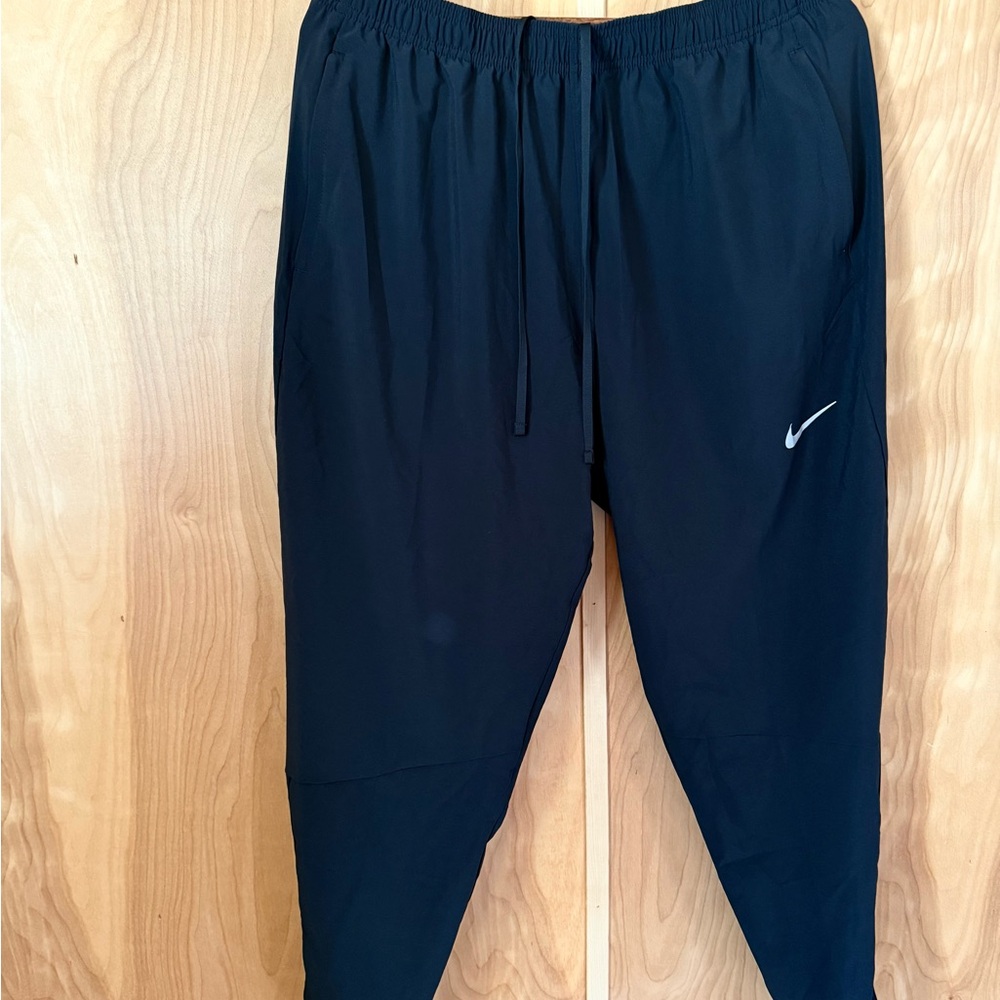 Nike Black Athletic Track Pants with White Swoosh